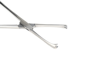 steel surgical clamp on white background