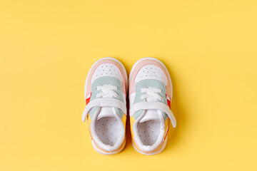 Baby sneakers. Set of baby clothes and accessories for spring or autumn. Fashion kids outfit. Flat lay, top view