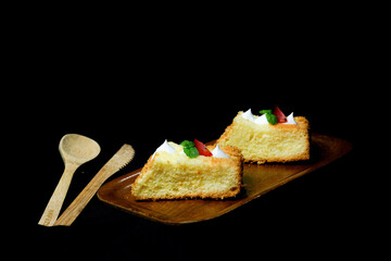 cheese chiffon cake on black background