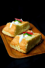 cheese chiffon cake on black background