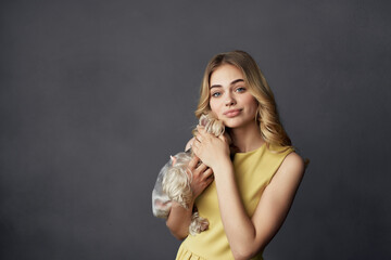 blonde with small purebred dog playing fun friendship
