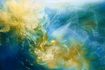 Fototapeta na wymiar Earth colors abstract background, colorful smoke paint underwater, swirling ink in water, exoplanet blue yellow sea ocean