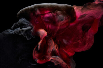 Fototapeta na wymiar Red black pigment swirling ink abstract background, liquid smoke paint underwater