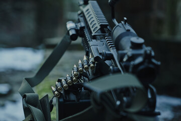 Fototapeta premium Loaded airsoft weapon close-up in the forest