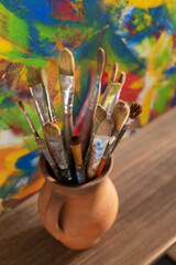 Fototapeta premium Paint brush and art painting canvas as abstract background texture. Paintbrush painting