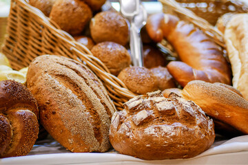 Various bread on shelf and in basket, Homemade bread. Fresh baked bread in baker shop.