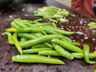 Green chili peppers on the table closeup shot