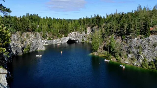 Marble quarry with the lake in Ruskeala park on a sunny day. Scenic view in Karelia 