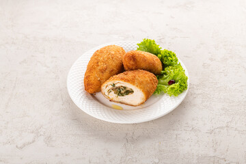 chicken breast cutlet on a white plate