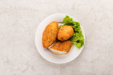 
Chicken Kiev cutlet on a white plate