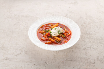 borscht with guine in a white plate