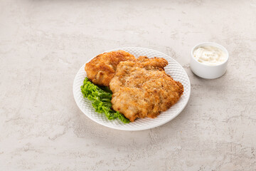 white meat chicken chop on a white plate