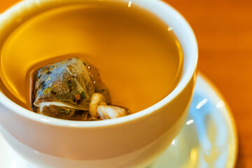 Craft flower tea in a self-tied bag.