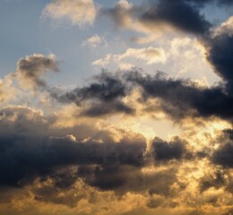 Fototapeta na wymiar Dreamy golden clouds in the blue sky