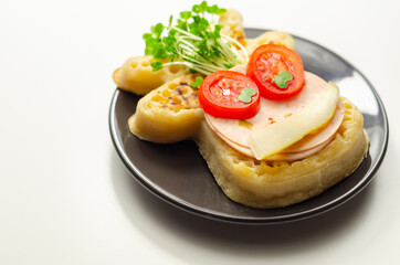 Reindeer shaped crumpets served with ham, tomato, cucumber, and watercress