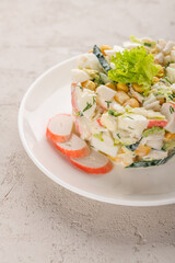 crab salad on a white plate