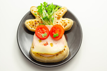 Reindeer shaped crumpets served with ham, tomato, cucumber, and watercress