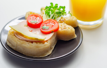 Reindeer shaped crumpets served with ham, tomato, cucumber, and watercress