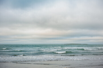 Beautiful dramatic sea waves and gloomy sky