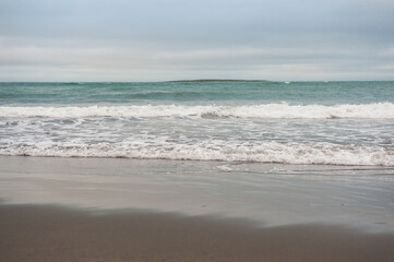 Fototapeta na wymiar Beautiful dramatic sea waves and gloomy sky