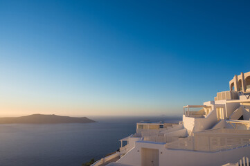 Obraz premium White architecture of Imerovigli on Santorini island, Greece. Luxury resort. View of Aegean sea and caldera.