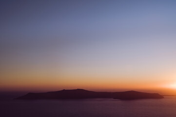 ful landscape of sunset above Aegean sea. Santorini luxury resort. Volcano island.