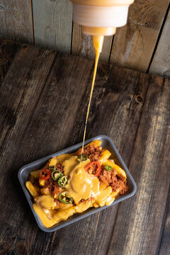 Delicious cheese fries with peppers