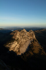 Naklejka premium Amazing view to the Lake Lucerne at an epic sunrise in the morning of a beautiful day. Drink a beer at the restaurant at the peak of this mountain called Mythen and watch the birds fly.