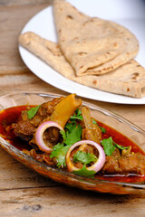 Mutton curry or meat dish with India style bread
