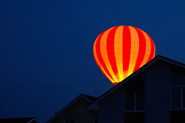 Fototapeta na wymiar The silhouette of ballons on sky background.