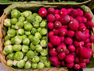 Red radishes and Brussels sprouts in the supermarket
