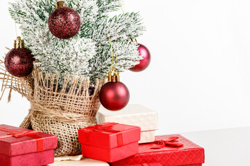 Fototapeta na wymiar Christmas tree gift boxes with toys on a white background