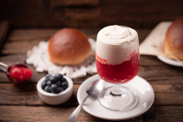 A delicious breakfast with strawberry granita and brioches, sicily.