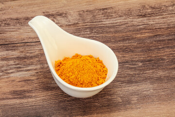 Tumeric powder in the bowl
