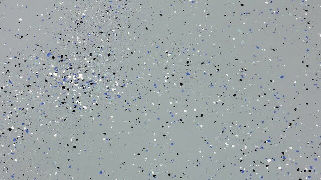 Panning left on the freshly painted garage floor with a gray epoxy finish sprinkled with blue, black and white plastic chips.