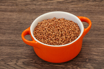 Raw buсkwheat cereal in the bowl