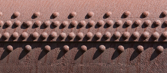 Rusty metal texture with rivets