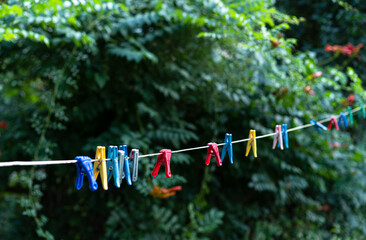 Fototapeta na wymiar Clothesline with clothespins for drying clothes