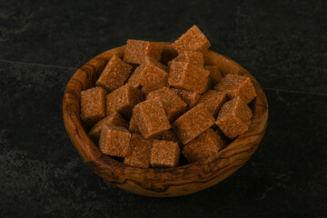Cane sugar cubs in the bowl