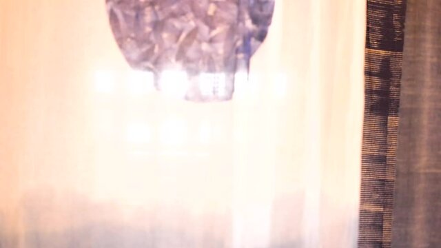Painted Sheet Of Cloth With The Sun Shining Through Window