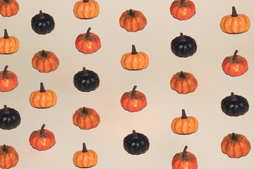 Autumn pattern of colorful pumpkins. Halloween minimal background. Creative holiday party concept.