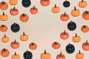 Autumn pattern of colorful pumpkins with copy space. Halloween minimal background. Creative holiday party concept.