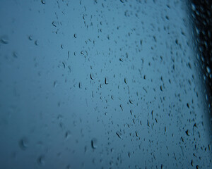 Wet window glass with raindrops cold weather