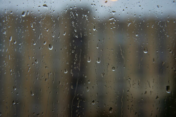 Wet window glass with raindrops cold weather