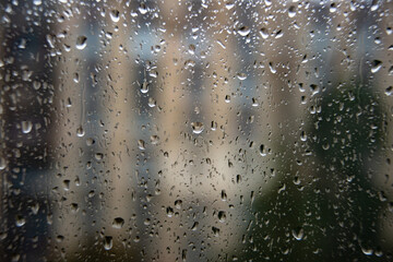 Wet window glass with raindrops cold weather