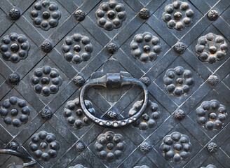 Hand knocker on a door.