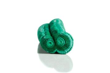 Macro mineral stone malachite stalactite on white background