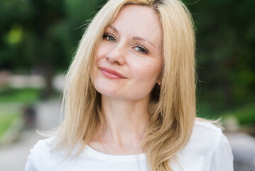 Obraz premium Portrait of a beautiful caucasian blonde woman. Femininity concept.
