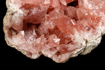 Macro mineral stone Pink Amethyst on a black background