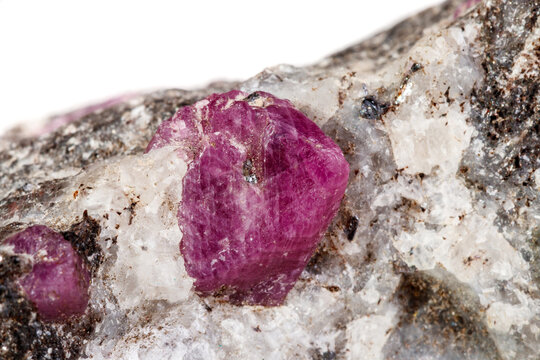 Macro of a mineral Ruby stone on a white background